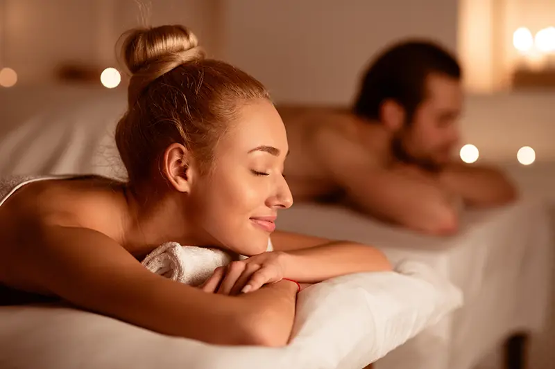Couple enjoying relaxing massage therapy at spa
